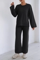 Détails d'un ensemble deux pièces en maille noire avec poignets côtelés et pantalon large - S / Noir