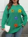 Dettaglio di maglione verde a trecce con fiori colorati lavorati a mano all'uncinetto 3D - 0XL / Verde