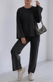 Detail of black knit loungewear set with crewneck sweater and wide-leg trousers - S / Top And Bottom / Black
