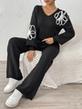 Detail of floral embroidery on sleeve of V-neck black knit sweater and wide leg pants set - S / Top And Bottom / Black Zirconia Set