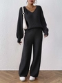 Close-up of black knit set featuring vertical ribbed texture on V-neck sweater and wide pants - S / Black