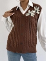 Detail of cable knit vest featuring 3D white flower applique and decorative black ribbons - One Size / Tops / Coffee