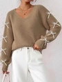 Close-up detail of khaki V-neck ribbed knit sweater with decorative white ribbon bows - S / Khaki