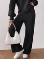 Détail de l'ensemble en maille côtelée noire avec pantalon large à taille haute - S / Noir