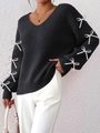 Close-up of black V-neck knit sweater with white ribbon bows on long sleeves - S / Tops / Black (Bowknot Decoration)