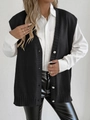 Detailed close-up of a black knit vest featuring elegant white pearl button fastenings - One Size / Tops / Black