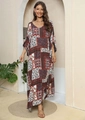Close-up detail of bohemian patchwork print on a loose-fitting ethnic kaftan maxi dress - One Size / Red