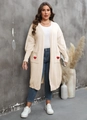 Detail of soft beige knit cardigan featuring large front pockets with red heart embroidery - Apricot