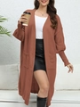 Detail of rust red knit cardigan featuring practical side pockets and ribbed cuffs - One Size / Tops / Coffee