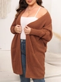 Detail of loose fit brown knit cardigan featuring large side pockets and ribbed texture - 1XL / Brown