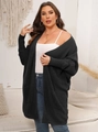 Detail of the oversized dark grey batwing sleeve cardigan with two large front pockets - 1XL / Black