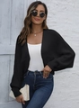 Dettaglio di un cardigan nero in maglia con maniche a pipistrello e stile casual da donna - S / Nero