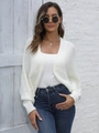 Dettaglio del cardigan bianco in maglia grossa con polsini a coste e taglio casual ampio - S / Bianco