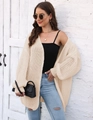 Close-up of beige chunky knit cardigan showing thick texture and loose-fit sleeve detail - One Size / Apricot