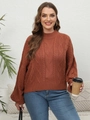 Détail d'un pull en maille torsadée rouille avec col montant et manches lanternes - 1XL / Marron