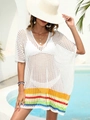 Detail of white crochet beach cover-up featuring vibrant rainbow striped hem design - One Size / Tops / White