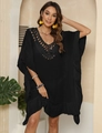 Detailed close-up of crochet hollow neckline and ruffled hem on black beach cover-up dress - One Size / Black