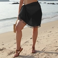 Detail of black sarong skirt featuring bohemian fringe hem and lightweight fabric - One Size / Bottoms / Black