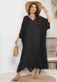 Detail of a black V-neck kaftan maxi dress with side slits and linen texture in home setting - One Size / Black
