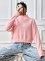 Close-up of pink turtleneck knit sweater with ribbed cuffs and hem on model - S / Pink
