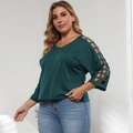 Detail of V-neck plus size dark green top with unique mesh hollow out cutouts on sleeves - 1XL / Dark Green