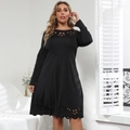 Close-up of elegant black long-sleeve dress featuring intricate laser-cut floral details - L / Black