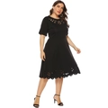 Detail showing laser-cut floral cutouts and textured fabric on plus size black dress - 0XL / Black