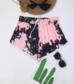 Flat lay of tie-dye lounge shorts with white drawstring and decorative summer accessories - 0XL/L / Tie-Dye Pink & Black