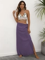 Detail of bohemian crochet halter top with shells and purple wrap skirt with tassels - One Size / Bottoms / Purple