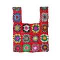 Close-up detail of crochet tote bag with colorful granny square flower patterns - Red