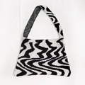 Close-up detail of thickened woven fabric and irregular black and white wave pattern - One Size / Black and White