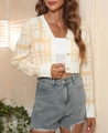Detail of yellow houndstooth knit cardigan with amber buttons and cropped design - S / Yellow