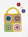 Detailed close-up of colorful granny square crochet patterns on a handmade ethnic tote bag - Yellow / One Size