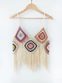 Detail of colorful granny square crochet crop top featuring long tassels and woven straps - One Size / Apricot