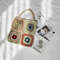 Macro detail of handmade crochet granny square tote bag with colorful floral patterns - Apricot / One Size