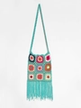 Detailed macro view of hand-crocheted boho floral patterns and long fringe texture - Sky Blue