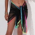 Detail of black mesh beach wrap with colorful pompom trim and adjustable tie closure - One Size / Bottoms / Black