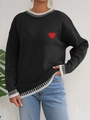 Close-up of red heart embroidery on black knit sweater with striped ribbed neckline - S / Tops / Black