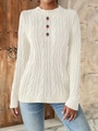 Detail of white cable knit sweater featuring three small strawberry embroidery patches - S / White