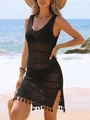 Close-up of black hollow-out crochet beach dress featuring V-neck and fringe tassel hem - S / Tops / Black