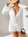 Detail of deep V-neckline with golden seashell buckle on white crochet beach dress - S / White