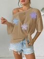 Detail of sheer mesh top with 3D floral appliques and side tie-knot waist detail - One Size / Khaki