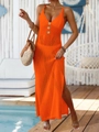 Detailed close-up of orange knit dress with gold buttons and high side slits - One Size / Orange