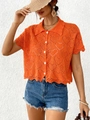 Dettaglio del cardigan arancione in maglia traforata a cuore con bottoni bianchi - S / Arancione