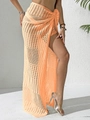 Detail of orange crochet beach wrap skirt showing hollow mesh knit texture and tie-waist - Bottoms / Orange