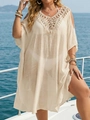 Detail of bohemian crochet neckline on a beige oversized beach cover-up dress - Apricot