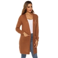Close-up of caramel knit cardigan featuring large square pockets and textured fabric - Khaki/Earth Yellow