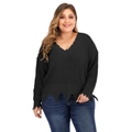Detail view of deep V-neckline and distressed frayed edges on a thick black knitted sweater - Black