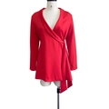 Detail view of red wrap dress showing the V-neckline and adjustable side waist tie - S / Red