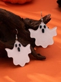 Close-up of ghost-shaped earrings with glitter finish hanging on a decorative branch - Fine Glitter White Ghost Drop Earrings